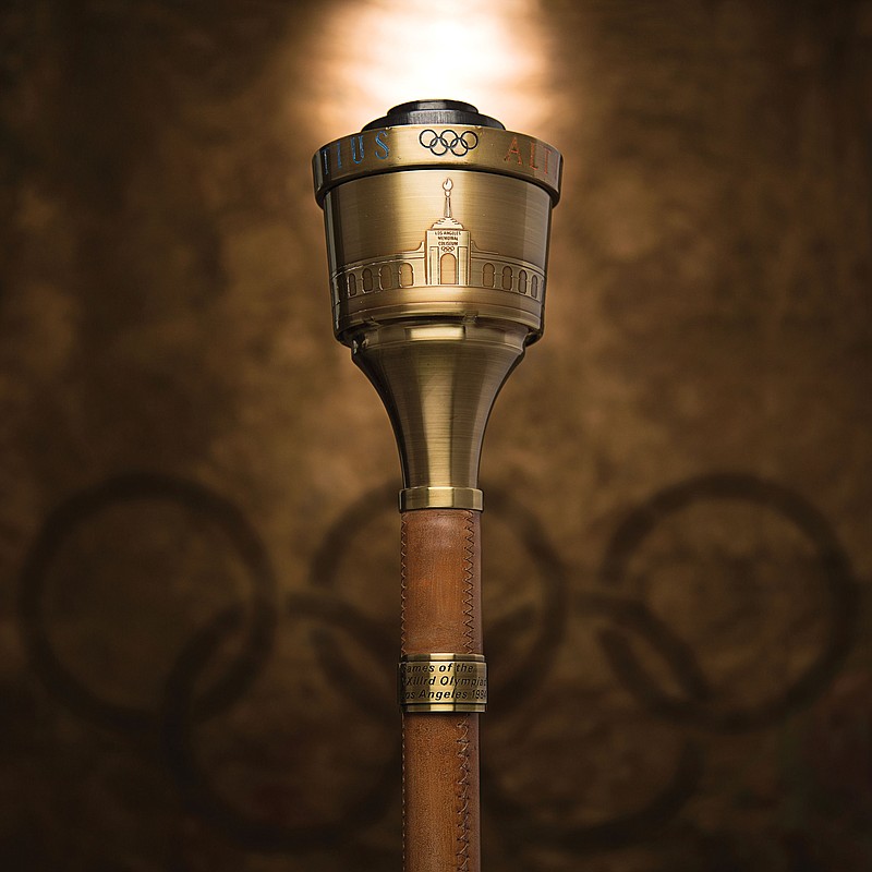 
              In this undated photo provided by Heritage Auctions, the 1984 Summer Olympics Torch that Bruce Jenner carried through Lake Tahoe, Nevada is shown. The 24-inch torch, featuring a brass finish and wood handle, is being offered by Heritage Auctions on July 30, 2015, at its Platinum Night Sports Auction in Chicago. It is the first significant piece of Jenner memorabilia to go to auction since the winner of the 1976 Olympic Decathlon Gold Medal became Caitlyn Jenner. (Heritage Auctions via AP)
            