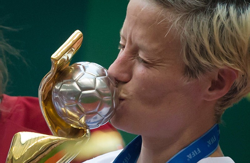 
              United States' Megan Rapinoe kisses the trophy after defeating Japan to win the FIFA Women's World Cup soccer championship in Vancouver, British Columbia, Canada, Sunday, July 5, 2015.   (DARRYL DYCK/The Canadian Press via AP) MANDATORY CREDIT
            