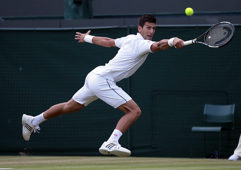
              Novak Djokovic of Serbia returns a ball to  Kevin Anderson of South Africa during their singles match against at the All England Lawn Tennis Championships in Wimbledon, London, Monday July 6, 2015. (AP Photo/Tim Ireland)
            