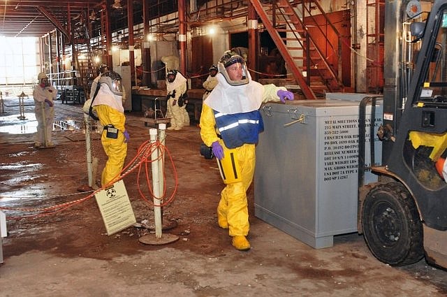 URS-CH2M Oak Ridge workers conduct pre-demolition activities recently inside K-27, a former uranium-enrichment facility in Oak Ridge. The big building is scheduled to be torn down by the end of 2016.