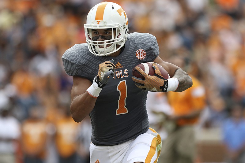 Staff Photo by Dan Henry / The Chattanooga Times Free Press- 4/25/15. The University of Tennessee's Jalen Hurd (1) runs the ball during the Dish Orange & White Game in Knoxville on Saturday, April 25, 2015.