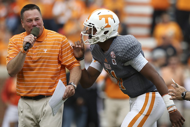The University of Tennessee quarterback Joshua Dobbs (11) gestures shush to head coach Butch Jones in this April 25, 2015, file photo.