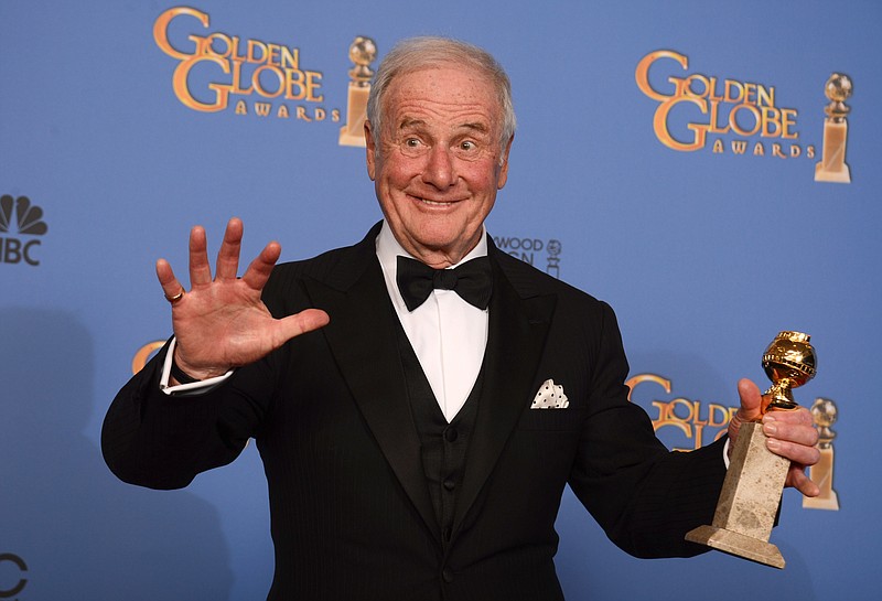 
              FILE - In this Jan. 12, 2014 file photo, producer Jerry Weintraub poses in the press room with the award for best mini-series or motion picture made for television for "Behind the Candelabra" at the 71st annual Golden Globe Awards in Beverly Hills, Calif.  Weintraub, the dynamic producer and manager who pushed the career of John Denver and produced such hit movies as "Nashville" and "Ocean's Eleven," died, Monday, July 6, 2015, of cardiac arrest in Santa Barbara, Calif. He was 77. (Photo by Jordan Strauss/Invision/AP, File)
            