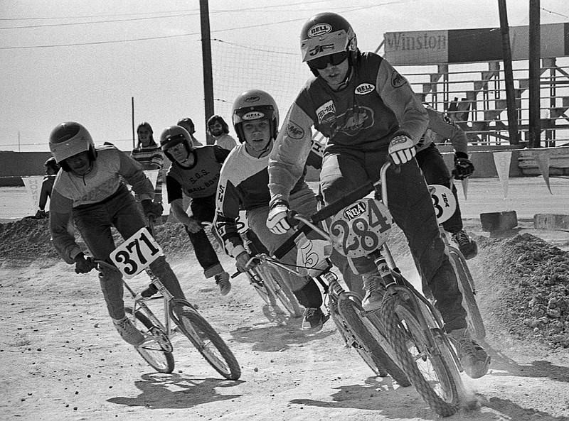 
              In this 1976 photo provided by USA BMX, Scot Breithaupt leads the pack in a BMX bicycle race in Las Vegas. Scot Alexander Breithaupt, who organized bicycle races on dirt motorcycle courses in the early 1970s, becoming a founder of BMX and later a champion and one of the cycling sport's best known figures, died in Indio, Calif., authorities said Monday, July 6, 2015.  (Courtesy Russ Okawa Archives/USA BMX via AP)
            