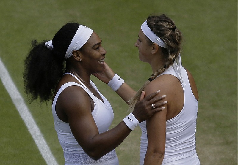 Serena Williams of the United States talks to Victoria Azarenka of Belarus, after defeating her in their singles match, at the All England Lawn Tennis Championships in Wimbledon, London, Tuesday July 7, 2015. Williams won 3-6, 6-2, 6-3. 