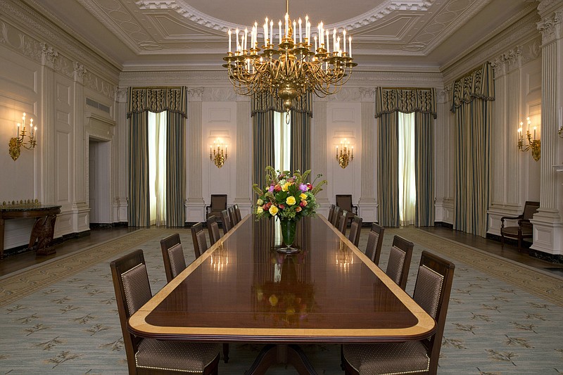 
              The State Dining room of the White House has been refurbished with new arm chairs, side chairs, and draperies suspended from carved and gilded poles, all of which were selected with the approval of the Committee for the Preservation of the White House in consultation with first lady Michelle Obama, as seen at the White House Tuesday, July 7, 2015 in Washington. (AP Photo/Jacquelyn Martin)
            