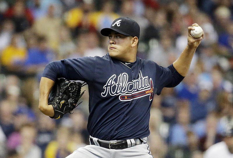 Atlanta Braves starting pitcher Manny Banuelos throws during the first inning of a baseball game against the Milwaukee Brewers Tuesday, July 7, 2015, in Milwaukee. 