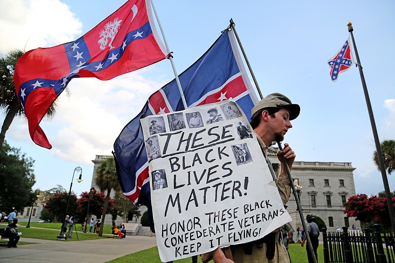 Josh Clarke, of Shelby, N.C., voices his side of the Confederate flag issue in front of the Statehouse, Monday, July 6, 2015, in Columbia, S.C.