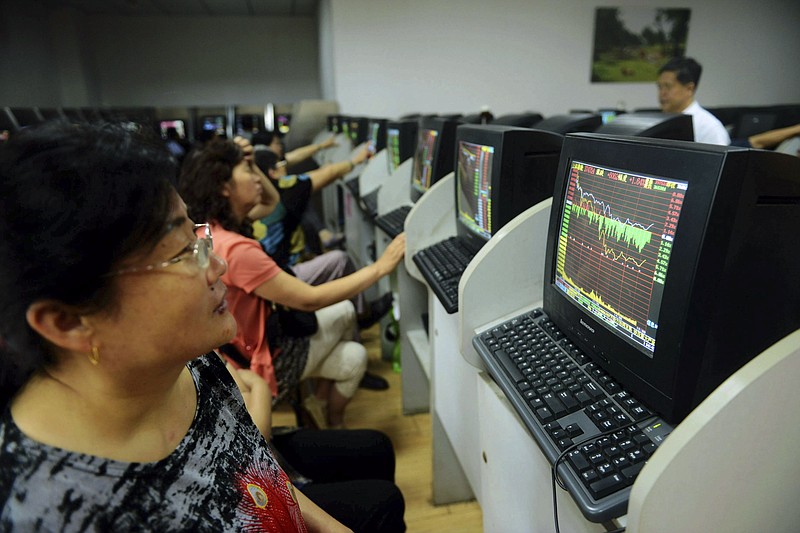 
              In this photo taken Monday, July 6, 2015, a stock investor monitors the Shanghai Composite Index at a brokerage house in Qingdao in east China's Shandong province. Chinese stocks fell Tuesday despite official efforts to shore up slumping prices while other Asian markets were mixed after Wall Street's decline. (Chinatopix Via AP) CHINA OUT
            