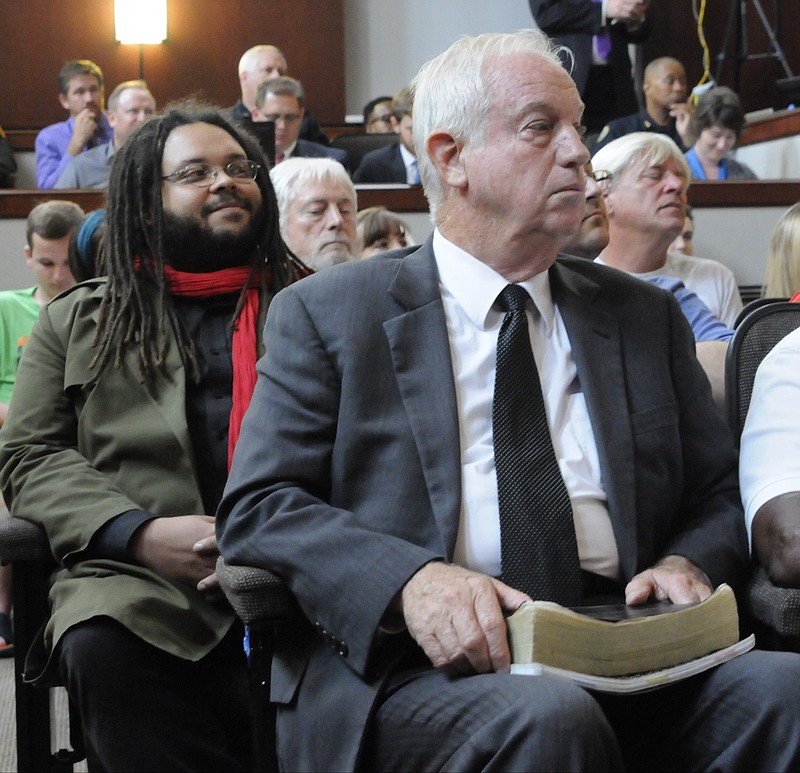 Staff photo by Tim Barber Marcus Ellsworth, left, and Charlie Wysong wait their turn on July 1 to speak their opinions to the Chattanooga City Council concerning the upcoming nondiscrimination ordinance.