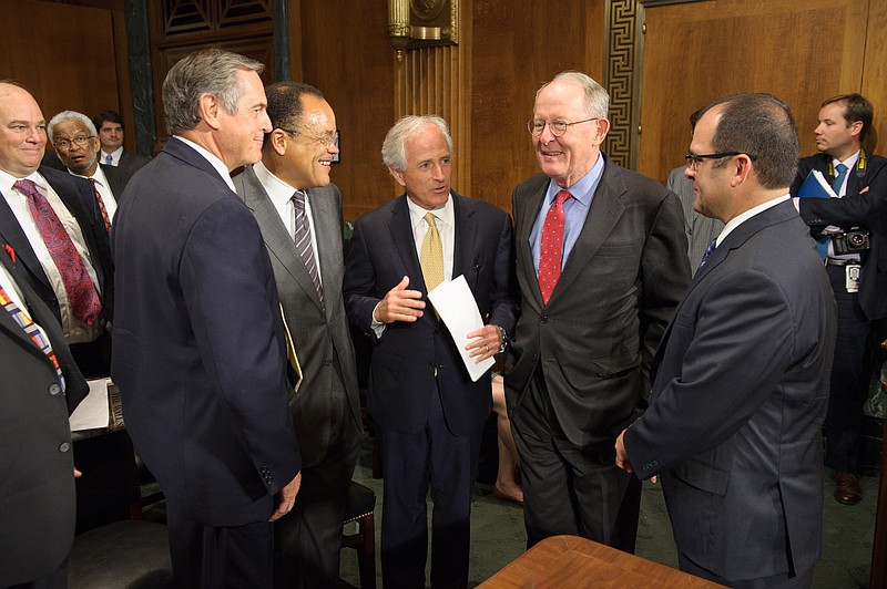 U.S. Sens. Bob Corker, center, and Lamar Alexander speak with Travis McDonough, right, in this June file photo in Washington, D.C. McDonough's nomination as federal judge for the Eastern District of Tennessee unanimously passed the Senate Judiciary Committee on Thursday and now will go before the full Senate.