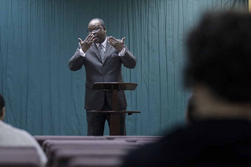 Mike Harper uses American Sign Language at the Jehovah's Witnesses Kingdom Hall in Alton Park.