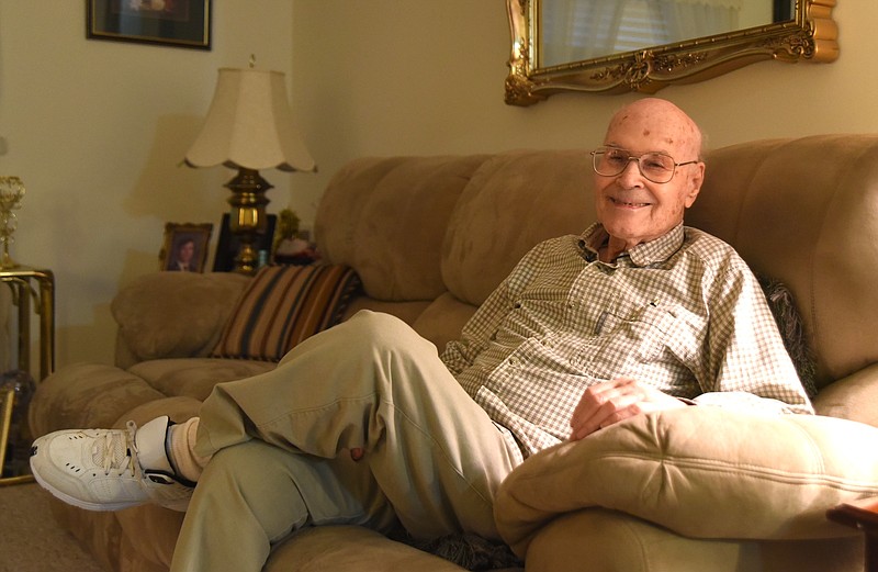 Winston Pennington sits in his room at Summitt View Senior Community. He turned 100 last week, but still is alert, active and drives.