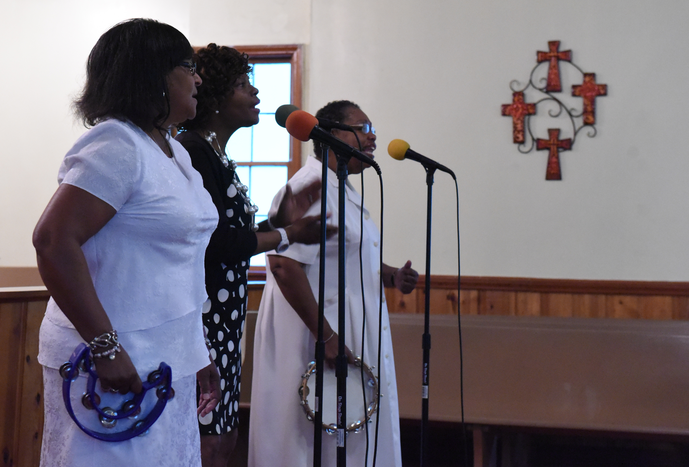 Linda Finley, Sharon Pollard and Veronica Pollard sing during a worship service at Hemphill African Methodist Episcopal Zion Church on Sunday in Summerville, Ga.