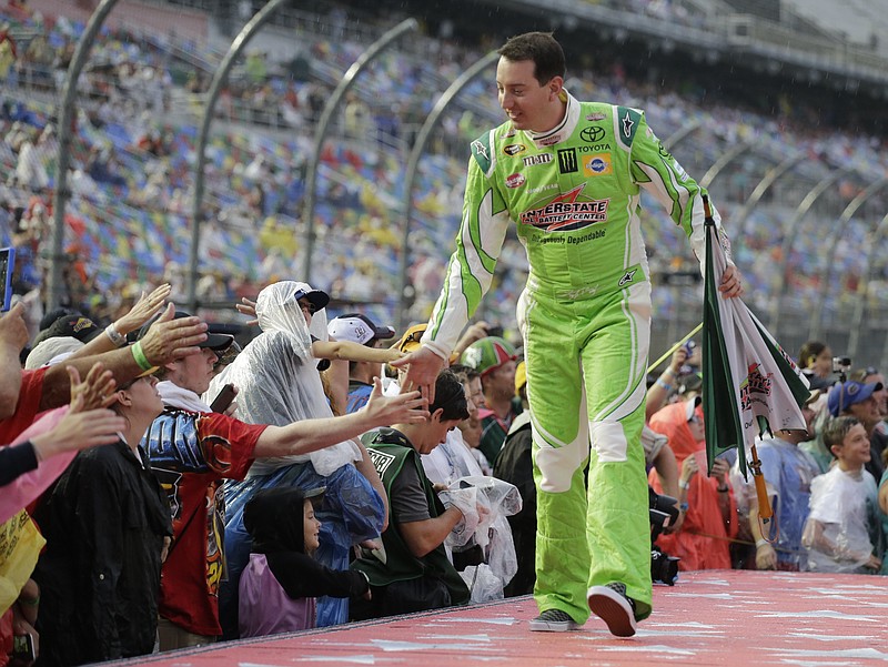 Kyle Busch during driver introductions before a NASCAR Sprint Cup series auto race at Daytona International Speedway, Sunday, July 5, 2015, in Daytona Beach, Fla. 