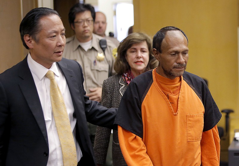 Juan Francisco Lopez-Sanchez, right, stands with his public defender Jeff Adachi, left, and Diana Garcia, an assistant district attorney, at Lopez-Sanchez arraignment in San Francisco last Tuesday. Sanchez, a Mexican laborer with a lengthy criminal record who was previously deported from the U.S., pleaded not guilty in the murder of Kathryn Steinle on Pier 14.