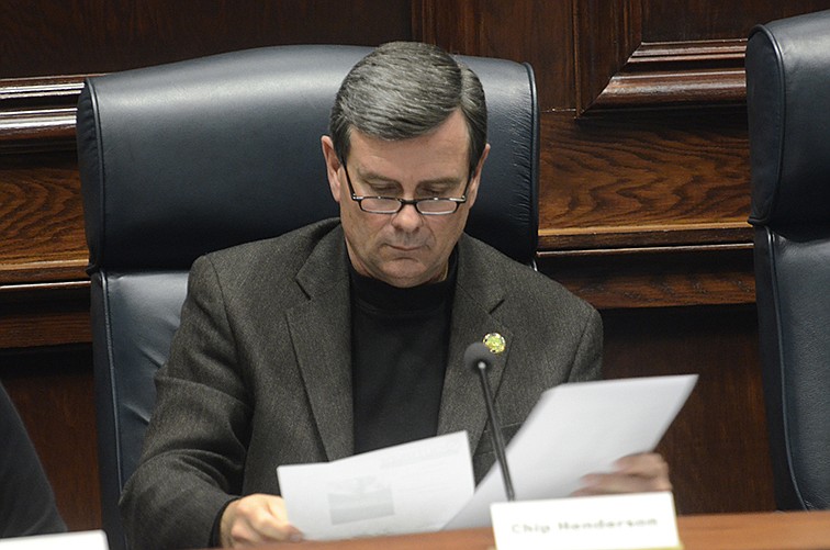 Chip Henderson looks at a handout during a 2014 planning commission meeting at the Hamilton County Courthouse.