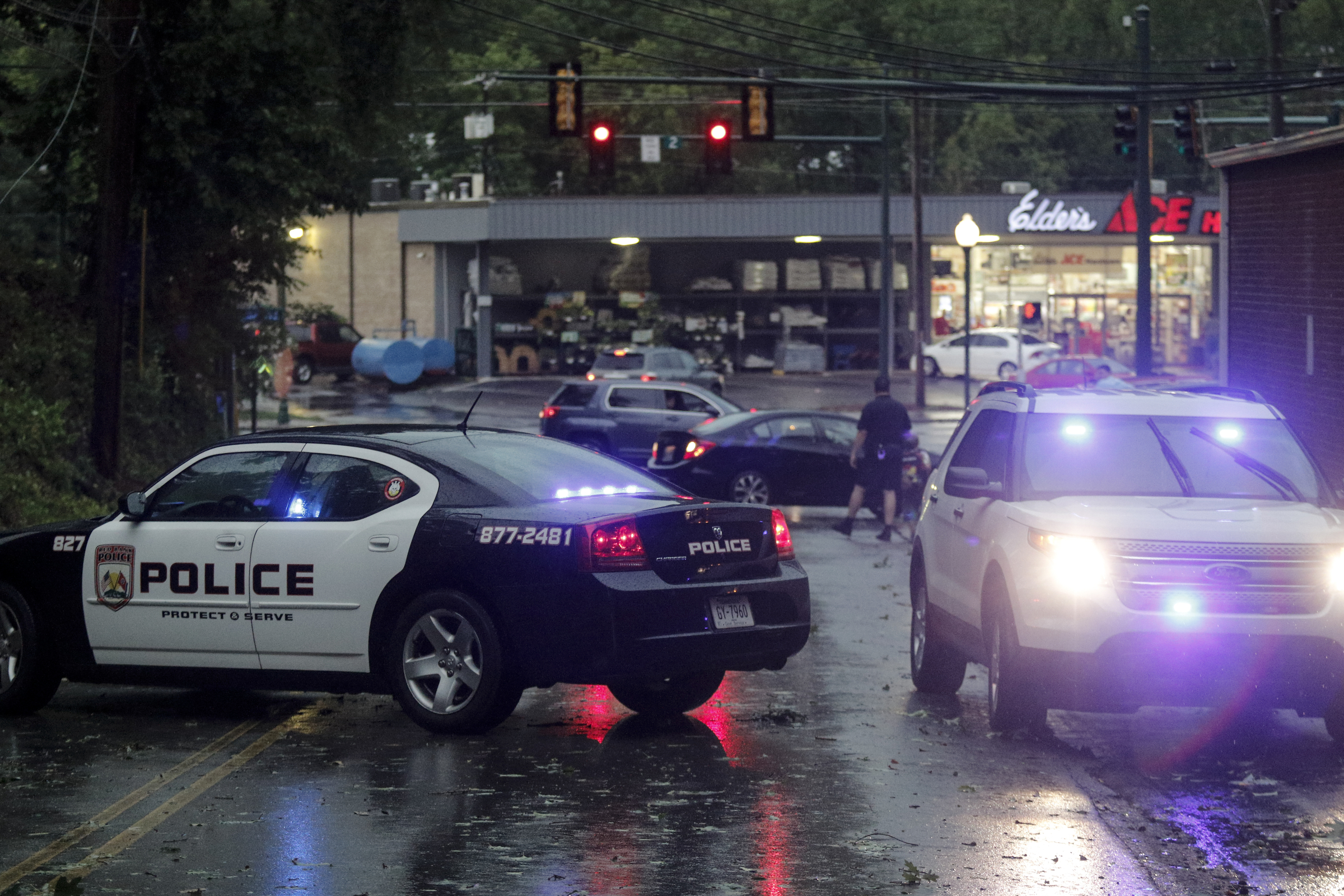Police block Hedgewood Drive from Dayton Boulevard after downed trees and power lines blocked access roads into the neighborhood after heavy thunderstorms swept through the region Tuesday, July 14, 2015, in Red Bank, Tenn.