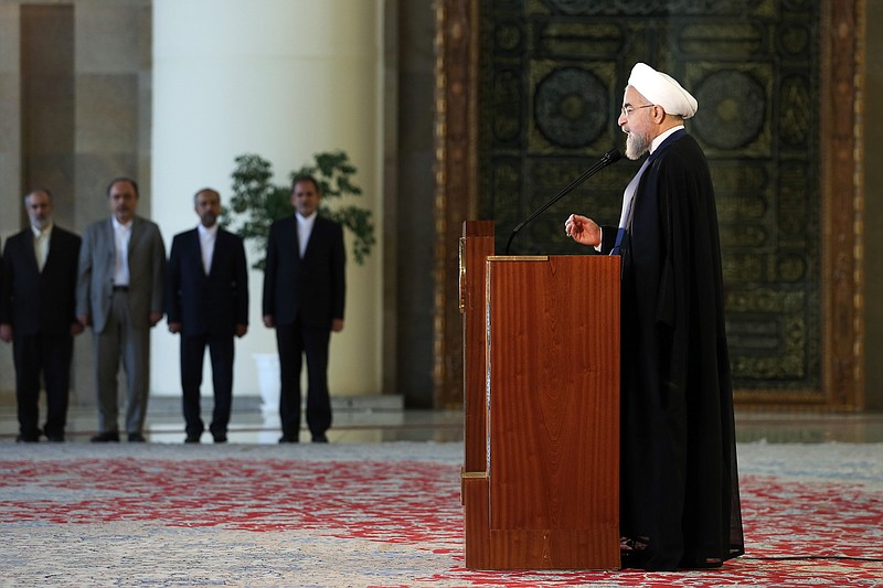 Iran's president Hassan Rouhani addresses the nation in a televised speech in Tehran, Iran, minutes after a landmark nuclear agreement was announced in Vienna on Tuesday, July 14, 2015.