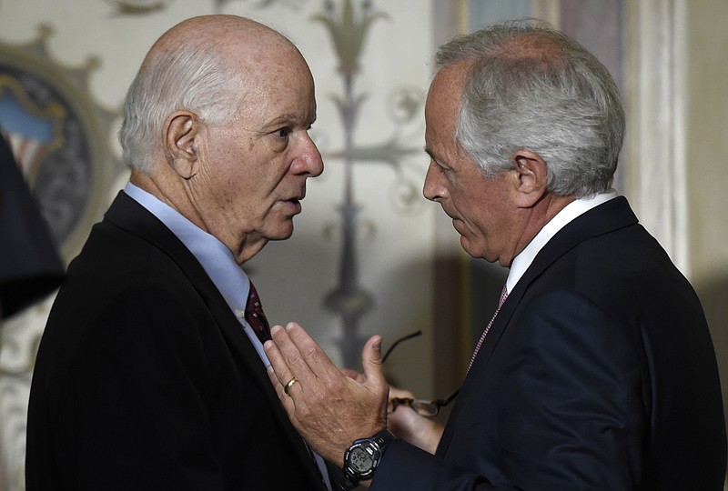 Senate Foreign Relations Committee Chairman Sen. Bob Corker, R-Tenn., right, talks with the committee's ranking member Sen. Ben Cardin, D-Md. on Capitol Hill in Washington, Thursday, July 16, 2015, following a meeting with Vice President Joe Biden and other committee members to discuss the nuclear agreement with Iran. (AP Photo/Susan Walsh)