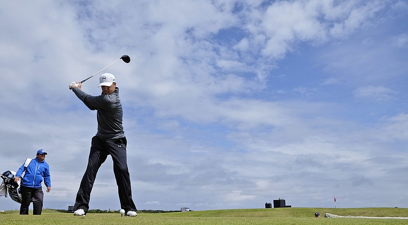 
              United States’ Jordan Spieth drives a ball from the 12th tee during a practice round at the British Open Golf Championship at the Old Course, St. Andrews, Scotland, Wednesday, July 15, 2015. (AP Photo/David J. Phillip)
            