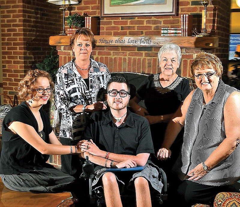 Daniel Bailer, center, and his family members were the first occupants of the Ronald McDonald House, which opened in 1990. Clockwise from center are Bailer, Mary Rice, Renee Bailer, Marie Economy and Jane Kaylor.