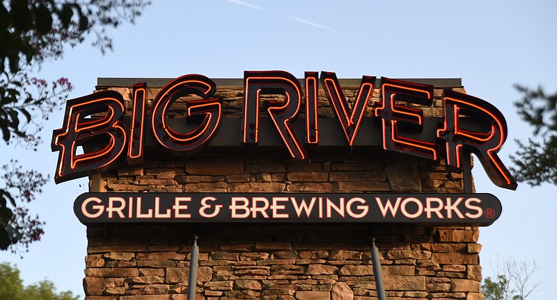 A neon sign marks Big River Grille and Brewing Works at Hamilton Place.