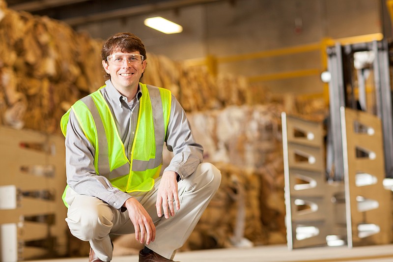 Wyatt Rollins, director of materials recovery operations, displays recycled material at Shaw plant