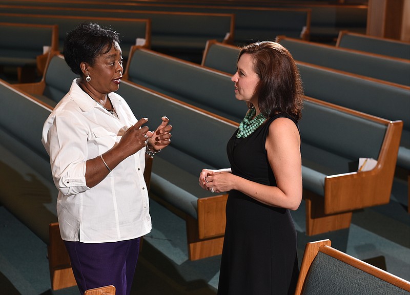 Rosalyn Hickman, left, executive director of Covenant Keypers (CQ), and Chandalee Chrisman (CQ), communications coordinator and women's ministry coordinator for the Stuart Heights Baptist Church, meet at the Stuart Heights Baptist Church Hixson campus on Tuesday, July 7, 2015, in Chattanooga, Tenn., to discuss an upcoming racially unified women's seminar. The all-day event will take place at the Hixson campus on July 18. 