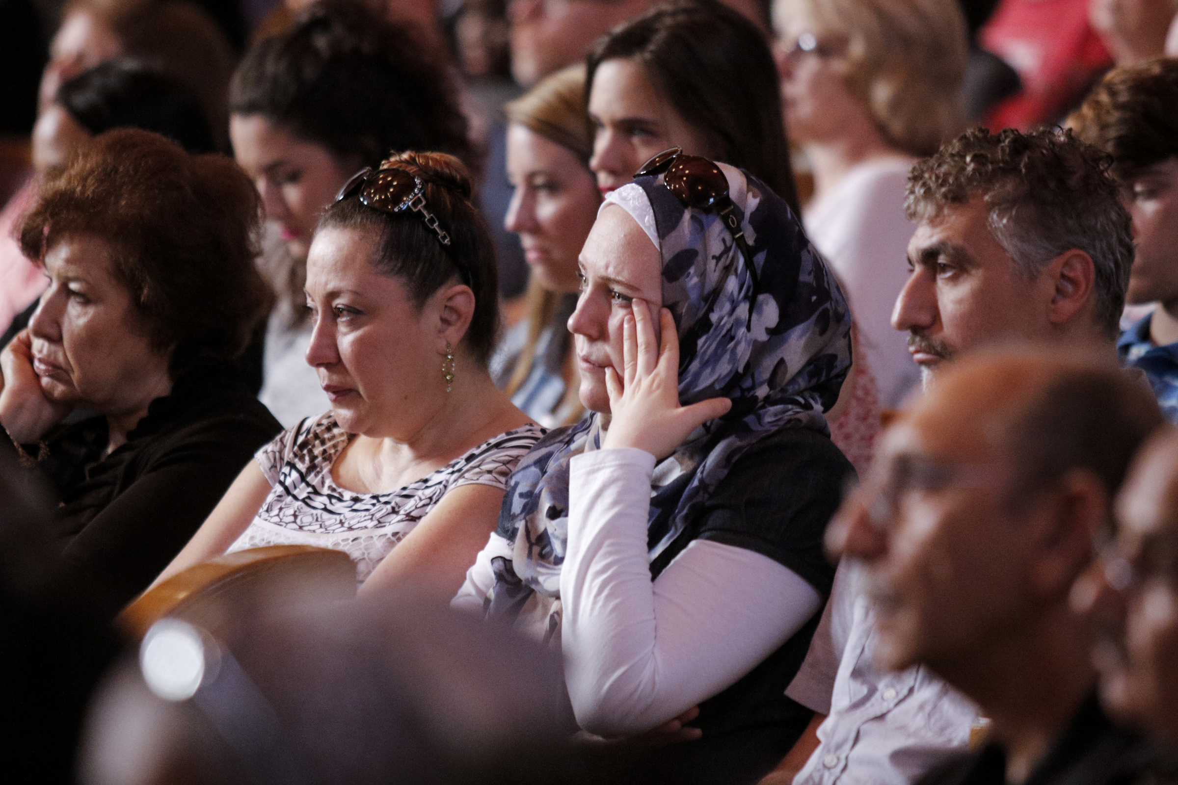Mounir Minkara, Diala Minkara, and Amani Issa, from right, who came with others from the Islamic Society of Greater Chattanooga to offer their support, listen during an interfaith vigil at Olivet Baptist Church held in remembrance of victims of the July, 16 shootings on Friday, July 17, 2015, in Chattanooga, Tenn. The vigil was held one day after gunman Mohammad Youssef Abdulazeez shot and killed four U.S. Marines and wounded two others and a Chattanooga police officer at the Naval Operational Support Center on Amnicola Highway shortly after firing into the Armed Forces Career Center on Lee Highway.