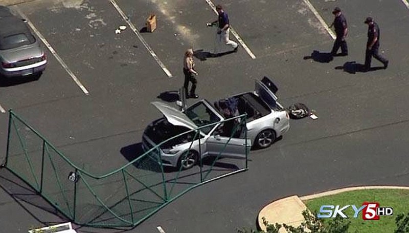 In this aerial image taken from video, law enforcement personnel work the scene of a shooting at the Navy Operational Support Center and Marine Corps Reserve Center Chattanooga, Thursday, July 16, 2015, in Chattanooga, Tenn. Authorities say Kuwait-born Mohammad Youssef Abdulazeez, 24 unleashed a barrage of gunfire from his car at a recruiting center and the U.S. military site, killing four Marines before he was shot to death by police. (WTVF via AP) 