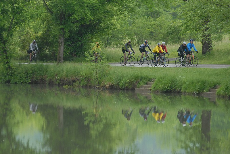 Cyclists ride through Ketner's Mill in this file photo.