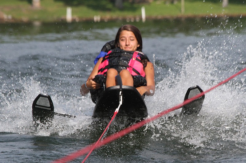 KayKay Sinclair from Macon, Ga., takes her turn skiing at the SPARC watersports day Saturday from the First Lutheran Church camp property at Possum Creek on Lake Chickamauga.
