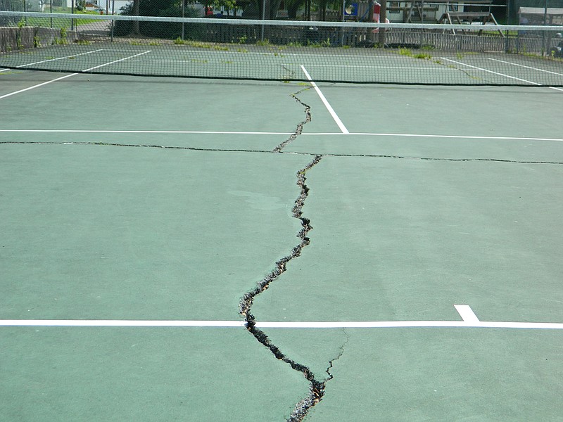 The Cleveland City Council has requested that the city's Parks and Recreation Department provide detailed scenarios concerning the funding and work associated with repairing, replacing or eliminating the tennis court at Deer Park. Fissures, some as wide and deep as two inches, crisscross the playing surface.PHOTO BY PAUL LEACH The Cleveland City Council has requested that the city's Parks and Recreation Department provide detailed scenarios concerning the funding and work associated with repairing, replacing or eliminating the tennis court at Deer Park. Fissures, some as wide and deep as two inches, crisscross the playing surface.