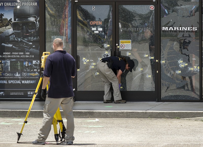 Investigators with the FBI work the scene of the July, 16 shooting at the Armed Forces Career Center on Lee Highway on Saturday, July 18, 2015, in Chattanooga, Tenn. U.S. Navy Petty Officer Randall Smith died Saturday from wounds sustained when gunman Mohammad Youssef Abdulazeez shot and killed four U.S. Marines and wounded two others and a Chattanooga police officer at the Naval Operational Support Center on Amnicola Highway shortly after firing into the Armed Forces Career Center.