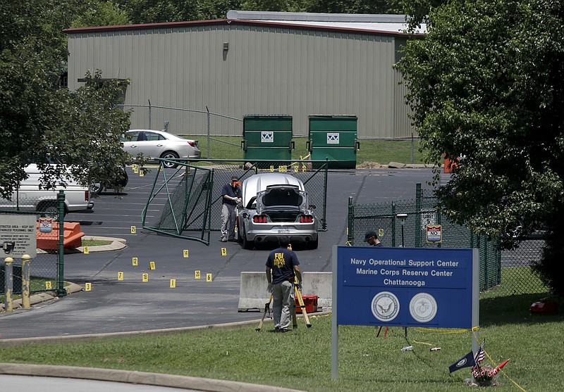 FBI investigators work the scene of the July, 16 shooting at the Naval Operational Support Center on Amnicola Highway on Saturday, July 18, 2015, in Chattanooga, Tenn. U.S. Navy Petty Officer Randall Smith died Saturday from wounds sustained when gunman Mohammad Youssef Abdulazeez shot and killed four U.S. Marines and wounded two others and a Chattanooga police officer at the Naval Operational Support Center shortly after firing into the Armed Forces Career Center on Lee Highway.