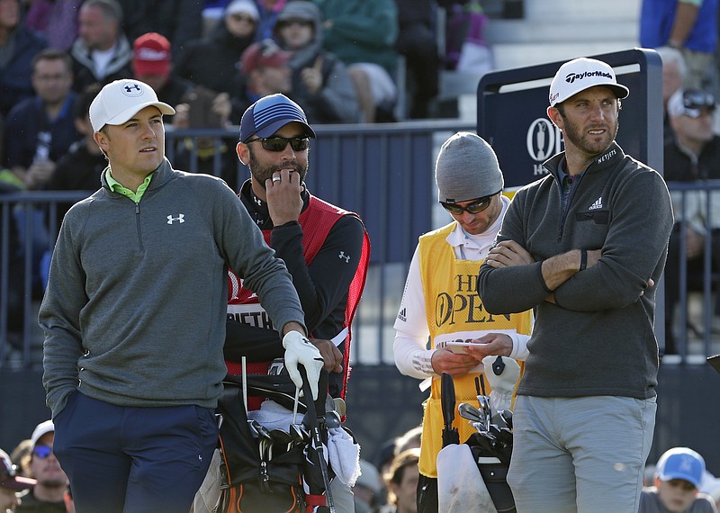 United States' Jordan Spieth, left, and United States' Dustin Johnson, right, wait to tee off from the 17th hole during the second round of the British Open Golf Championship at the Old Course, St. Andrews, Scotland, Saturday, July 18, 2015. 