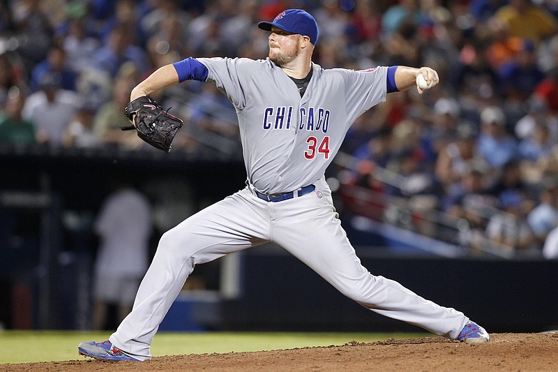 Chicago Cubs starting pitcher Jon Lester throws in the seventh inning of a baseball game against the Atlanta Braves, Saturday, July 18, 2015, in Atlanta.