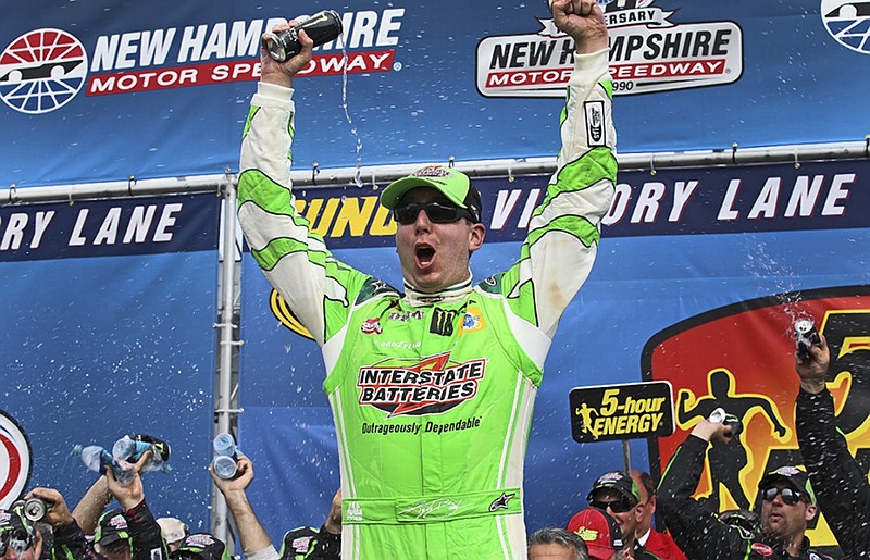 NASCAR Sprint Cup driver Kyle Busch celebrates after Sunday's win at New Hampshire Motor Speedway in Loudon, N.H.