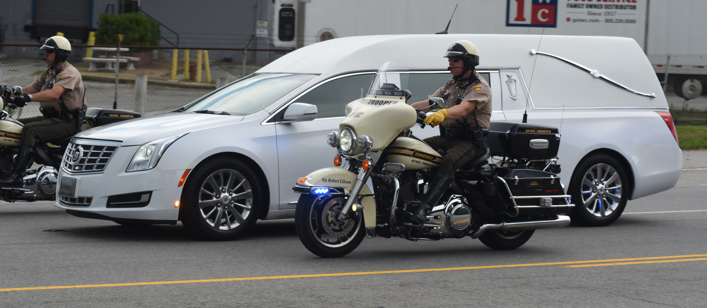Members of the Tennessee Highway Patrol escort a hearse carrying the body of slain U.S. Navy Petty Officer 2nd Class Randall Smith on Amnicola Highway just past the U.S. Naval and Marine Reserve Center on Sunday, July 19, 2015, in Chattanooga, Tenn. Before the body was taken to the Chattanooga Metropolitan Airport for transport to Dover Air Force Base, the motorcade drove past both shooting scenes involved in last Thursday's terrorist attack that killed Smith and four Marines.