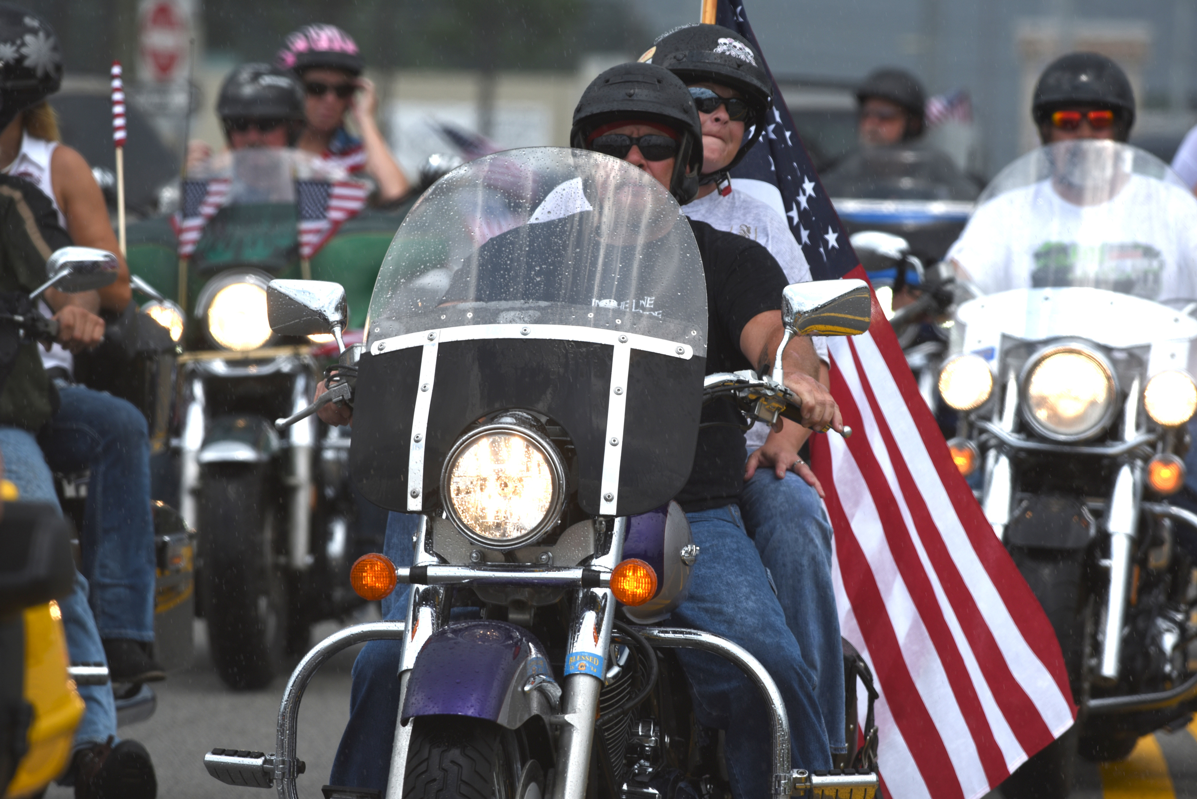 Motorcyclists gather in a parking lot on Lee Highway on Sunday, July 19, 2015, in Chattanooga, Tenn., as they prepare to ride from the Armed Forces Career Center to the U.S. Naval and Marine Reserve Center on Amnicola Highway in the aftermath of a Thursday terrorist attack at those two facilities that killed four Marines and one member of the U.S. Navy.