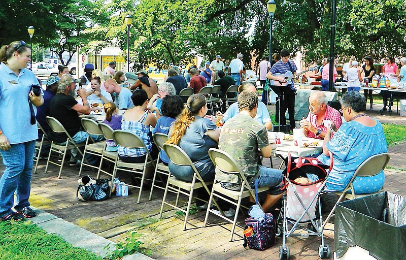 Members of Cleveland's homeless community join members of the city's downtown business establishments and passersby at a potluck held at Johnston Park. The event was planned and hosted by volunteers associated with Inspiring Tomorrow's Leader's Today, a youth group initiative of Family Cornerstones.