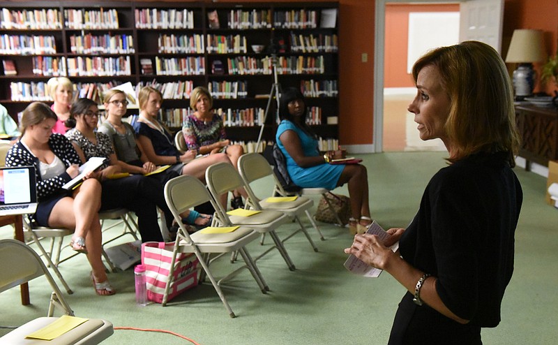 Becky Coleman, director of literacy for the Hamilton County Department of Education, speaks to a breakout group during the GradNation summit sponsored by the United Way and the HCDE and held at the downtown First Presbyterian Church on Monday, July 20, 2015, in Chattanooga, Tenn. 