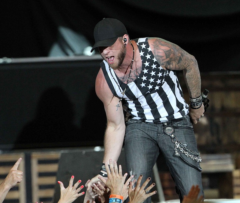 Brantley Gilbert performs the opening act for Kenny Chesney at the Georgia Dome on Saturday, June 13, 2015, in Atlanta.