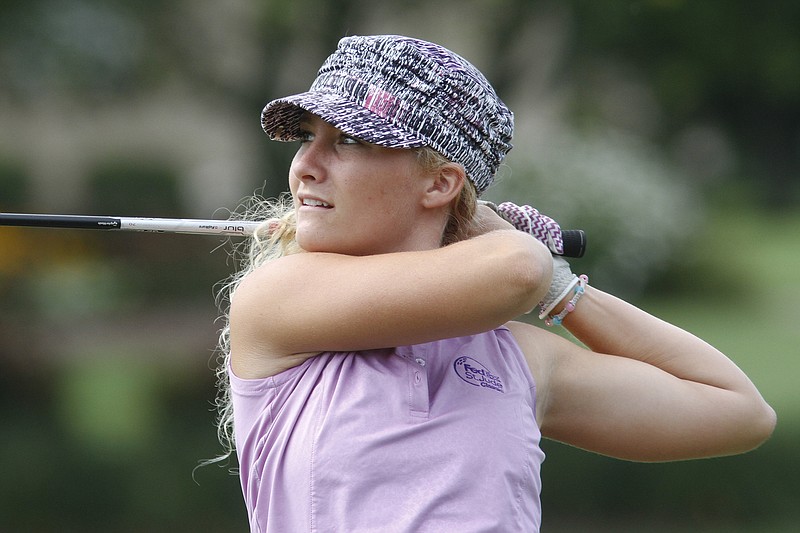 Samantha Griffith watches her ball fly while competing in the 2014 Women's City Championship at the Council Fire Golf Club on July 17, 2014.