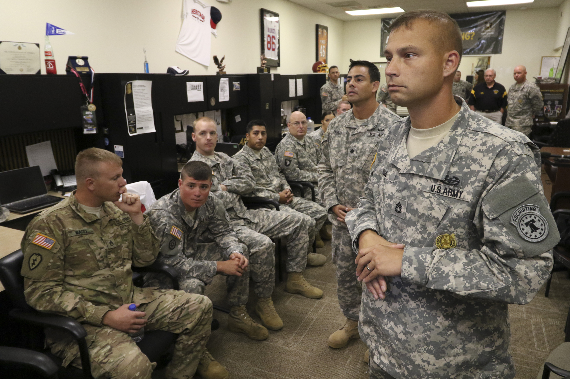 SFC Robert Dodge and LTC Tony Parilli, from right, speak to area Army recruiters at the Armed Forces Career Center off of Lee Highway before meeting with Chattanooga Mayor Andy Berke and Police Chief Fred Fletcher on Tuesday, July 21, 2015 where Army representatives thanked them for the quick response during the July 16, 2015 terror shootings.