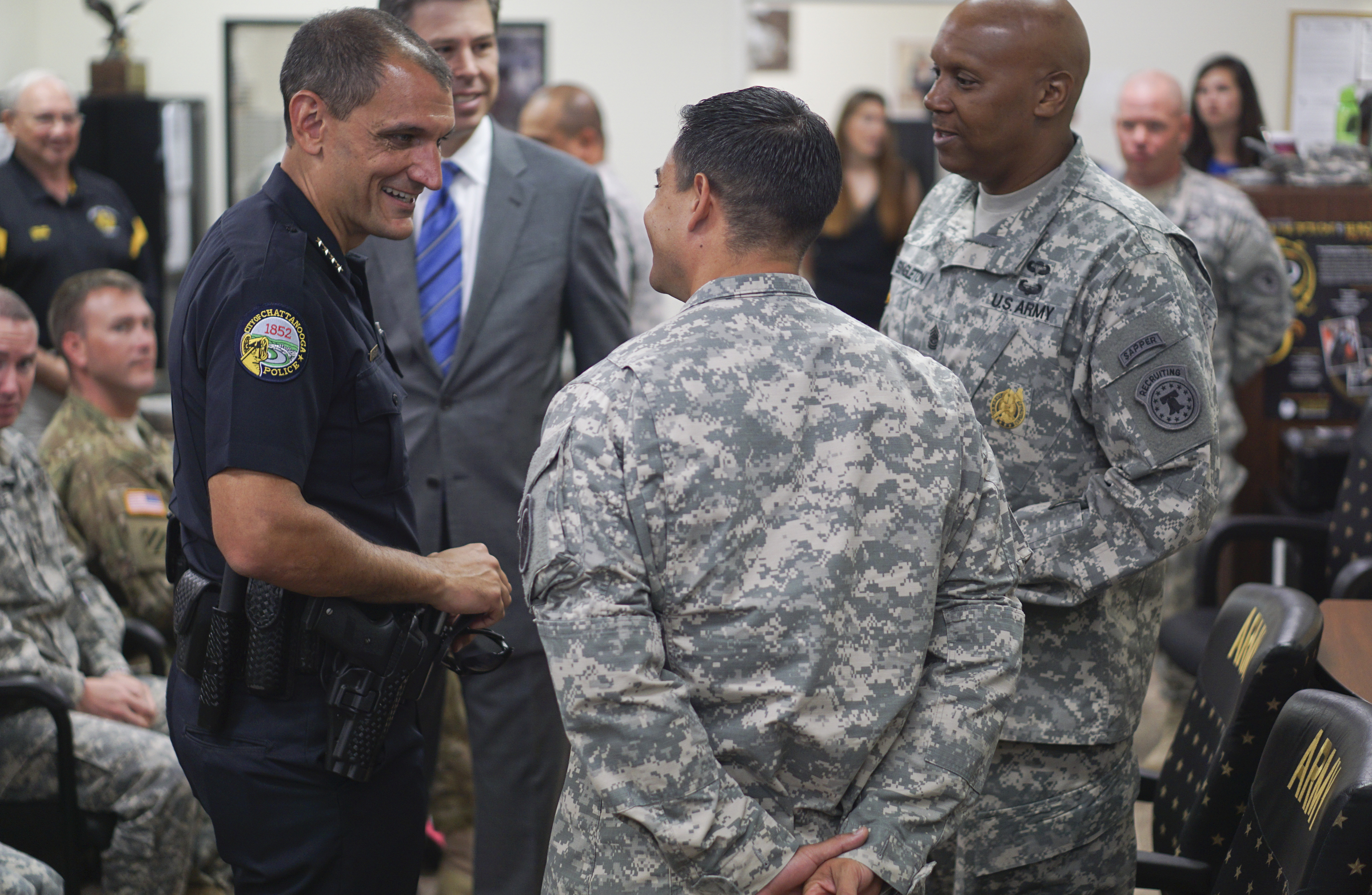LTC Tony Parilli, center, thanks Chattanooga Police Chief Fred Fletcher and Mayor Andy Berke while at the Armed Forces Career Center off of Lee Highway on Tuesday, July 21, 2015 for the city's quick response during the July 16, 2015 terror shootings .