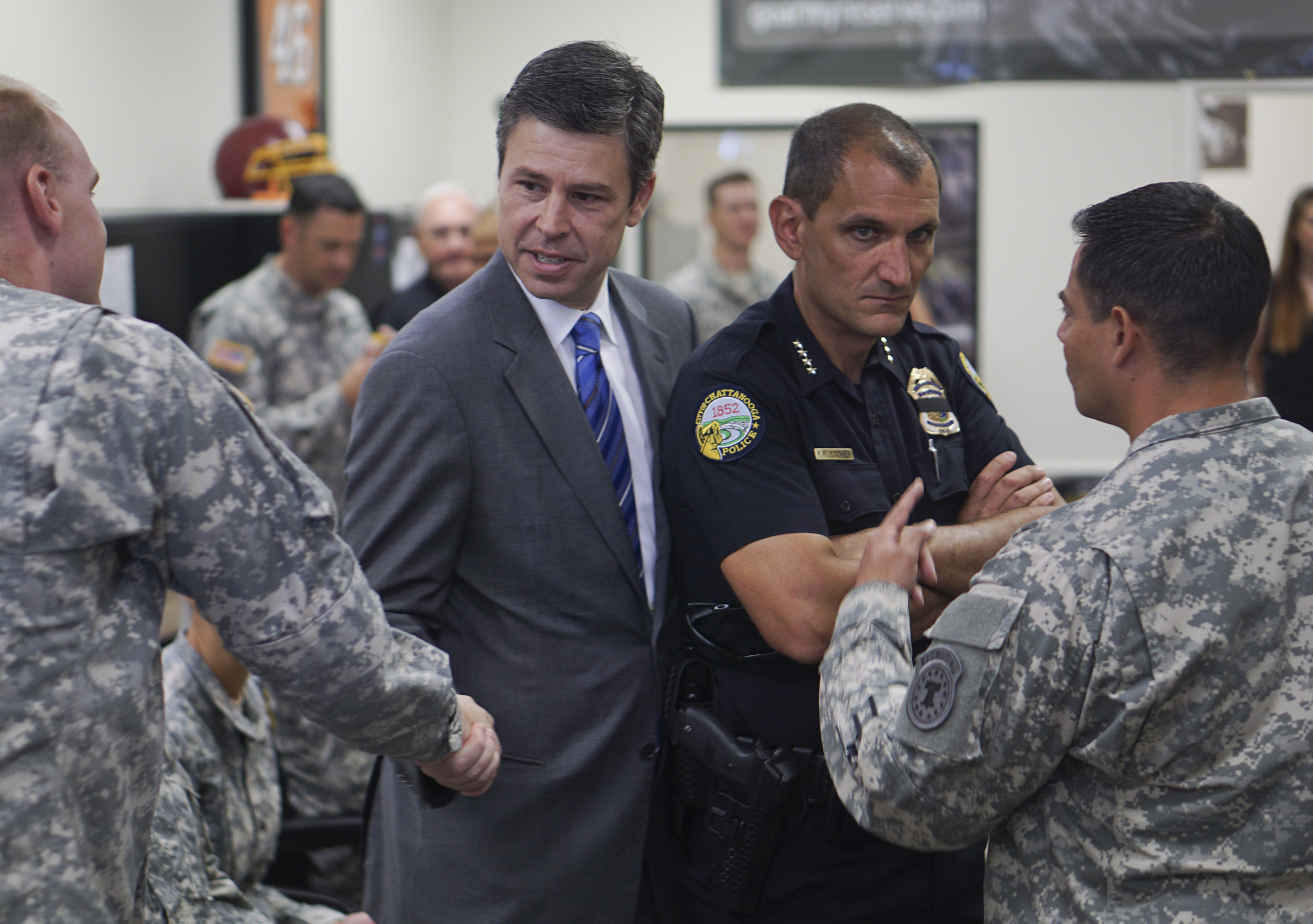Chattanooga Mayor Andy Berke and Police Chief Fred Fletcher are thanked by Army personnel while at the Armed Forces Career Center off of Lee Highway on Tuesday, July 21, 2015 for the city's quick response during the July 16, 2015 terror shootings .