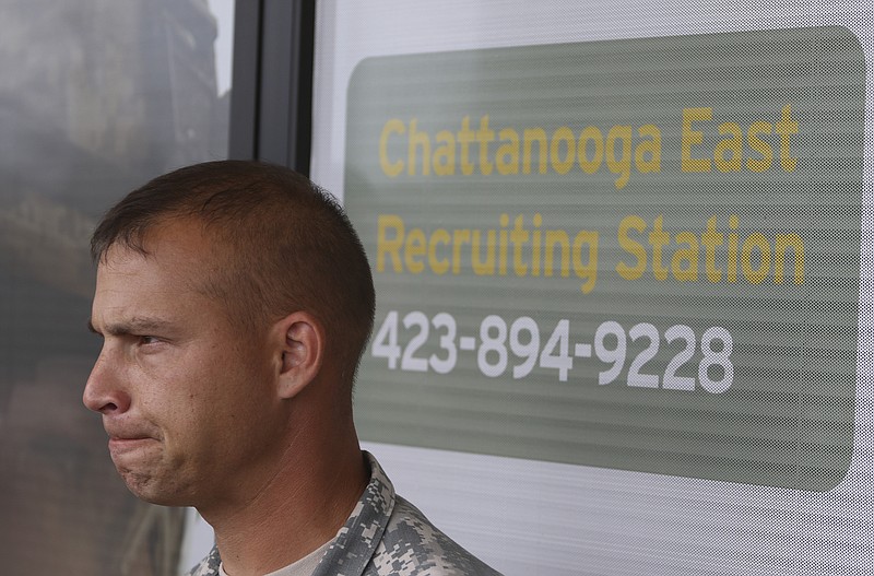 SFC Robert Dodge speaks to media outside of the Armed Forces Career Center off of Lee Highway after he and other Army representatives met Chattanooga Mayor Andy Berke and Police Chief Fred Fletcher on Tuesday, July 21, 2015 to thank them for the quick response during the July 16, 2015 terror shootings. 
