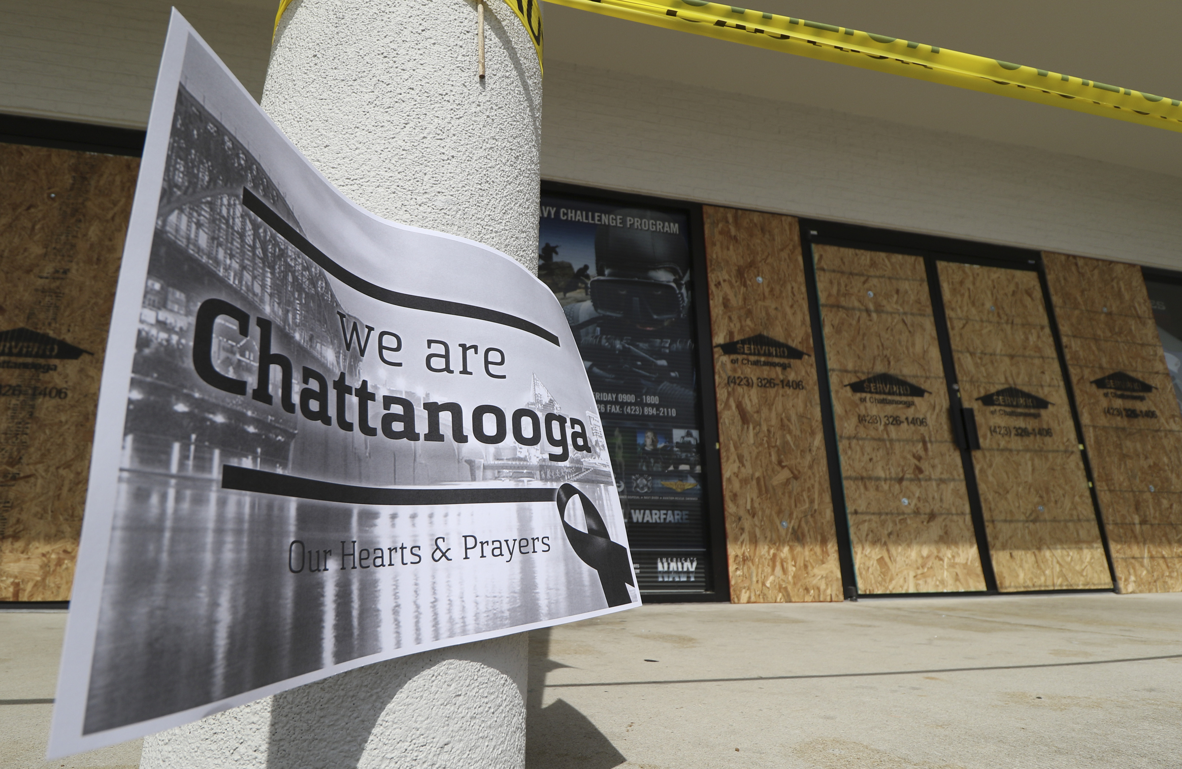 Windows remain boarded at the Armed Forces Career Center off of Lee Highway on Tuesday, July 21, 2015.